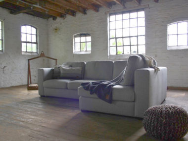 Country corner sofa Leona in a gray fabric
