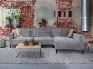 Corner sofa in a gray fabric with lumbar cushions