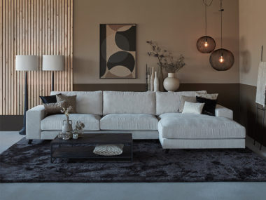Corner sofa Joëlle in a light Cream fabric with a large rug