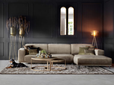 Corner sofa with lounge element in a velvet fabric, color taupe