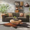 3-seater sofa Elise in Forest green fabric with cowhide rug and decorative cushions