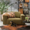 Spacious loveseat in a Moss green fabric with decoration and an artificial palm.