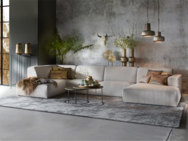Made-to-measure carpet Cassio in a light gray color number 23. with a beige corner sofa.