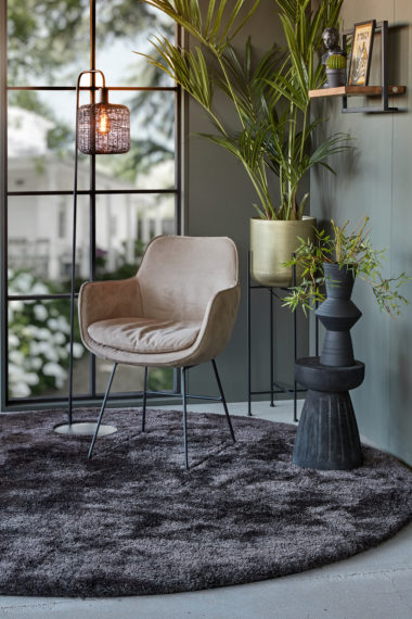 Gray chair in a velvet fabric with black sled legs