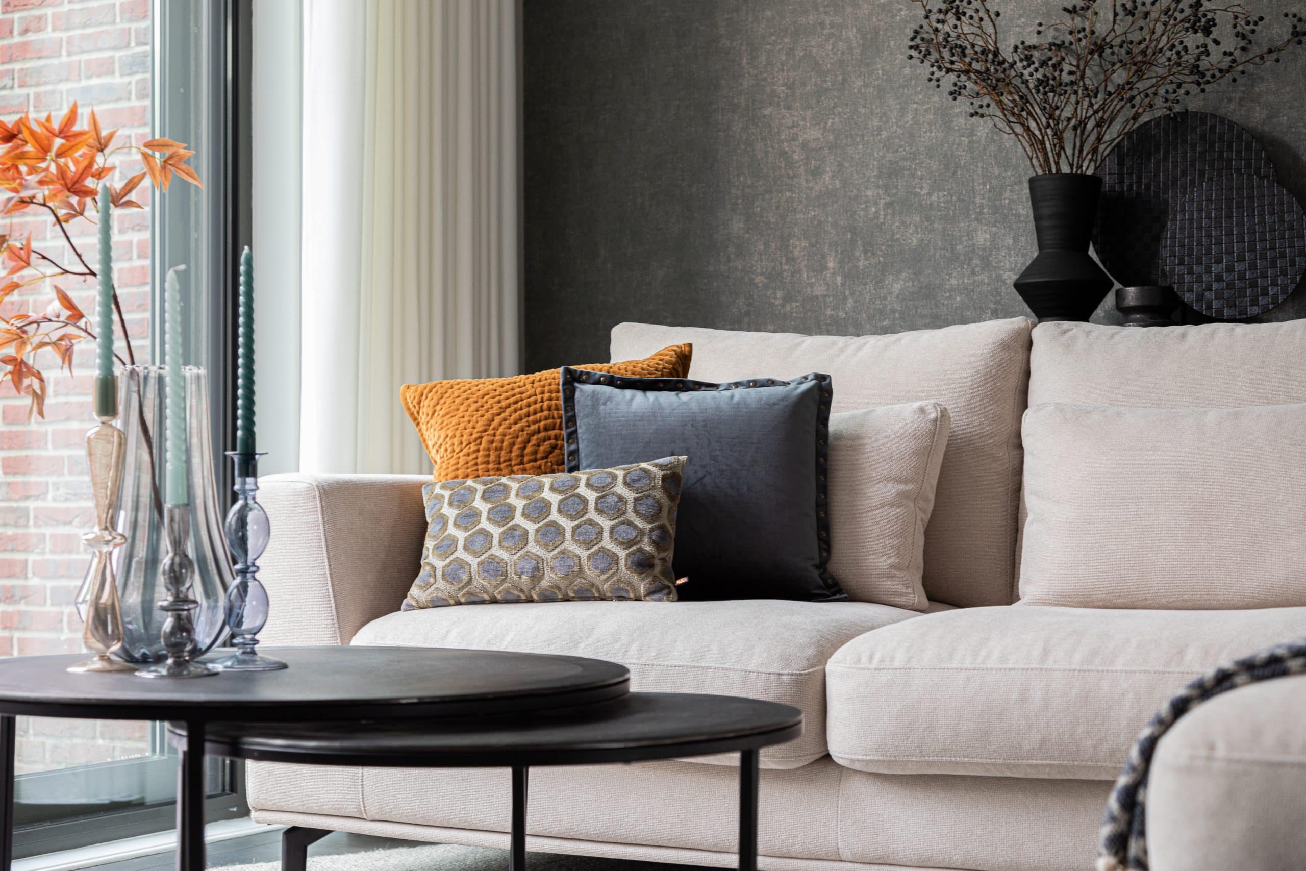 detail beige corner sofa with decorative cushions