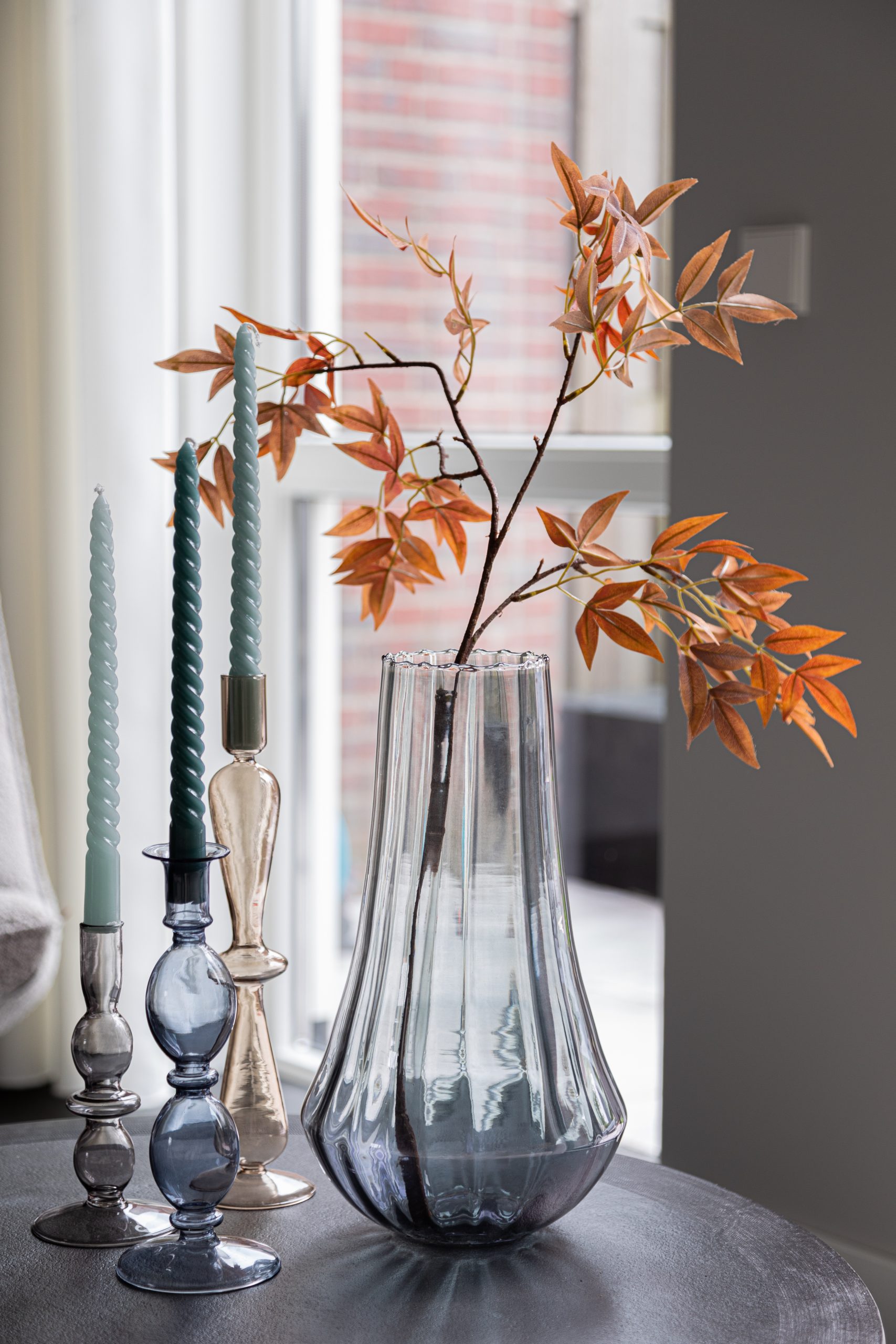 decoration, vase with artificial branch and candles