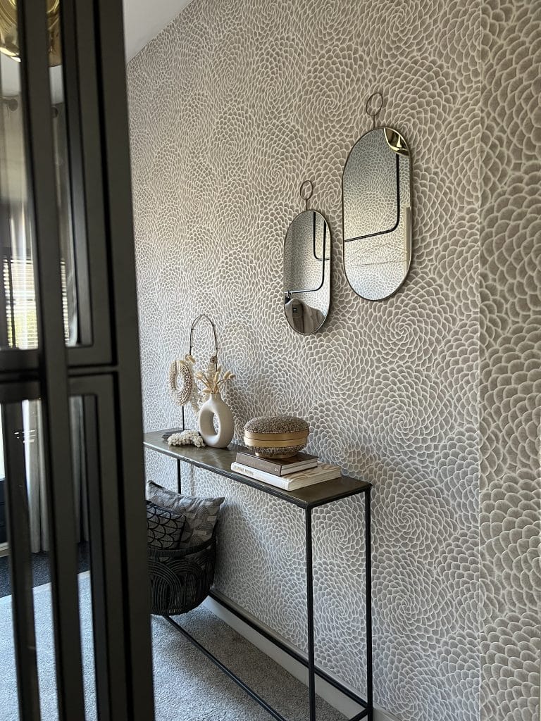 mirrors on wall with wallpaper