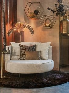 loveseat adele on high black legs with brown and gold accessories