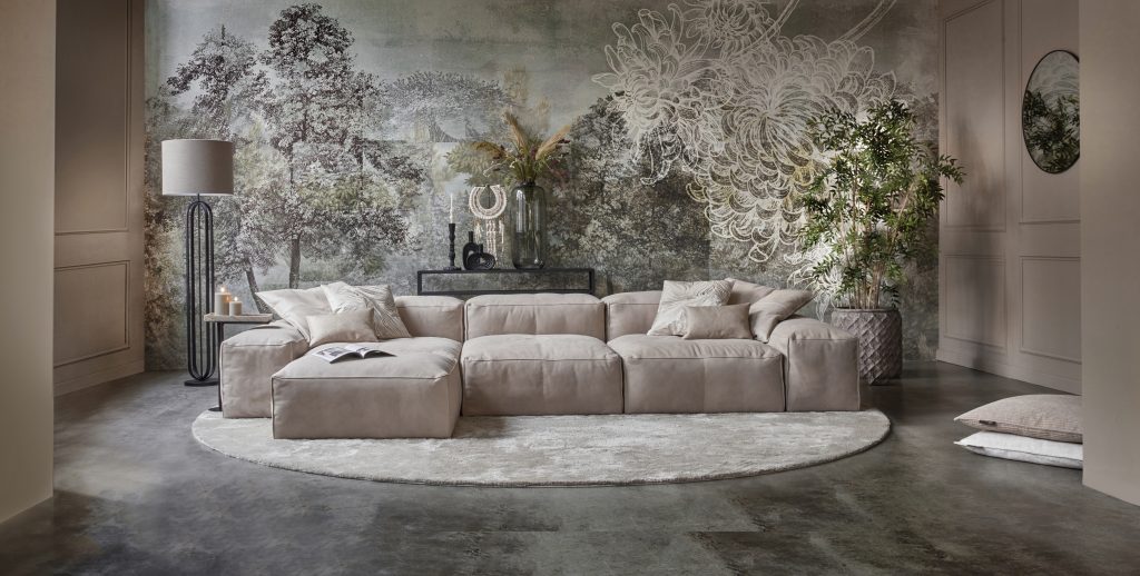 Element sofa with ottoman attached to it