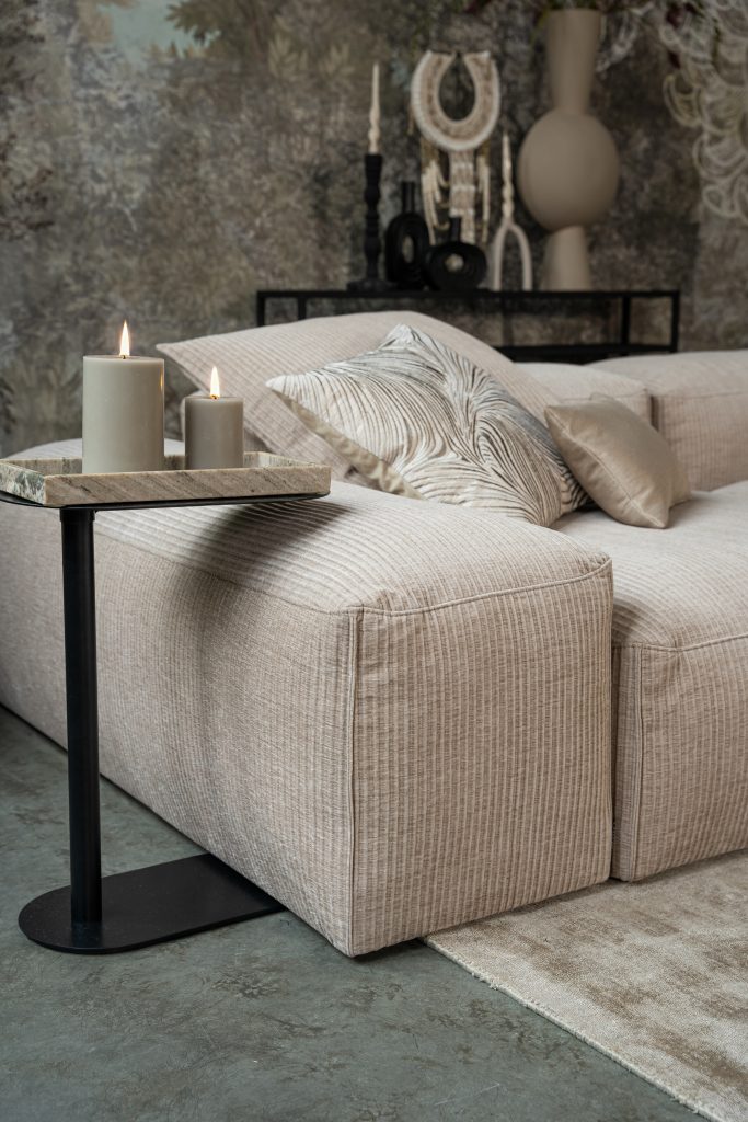 Corner of Bibi sectional sofa in ribbed fabric