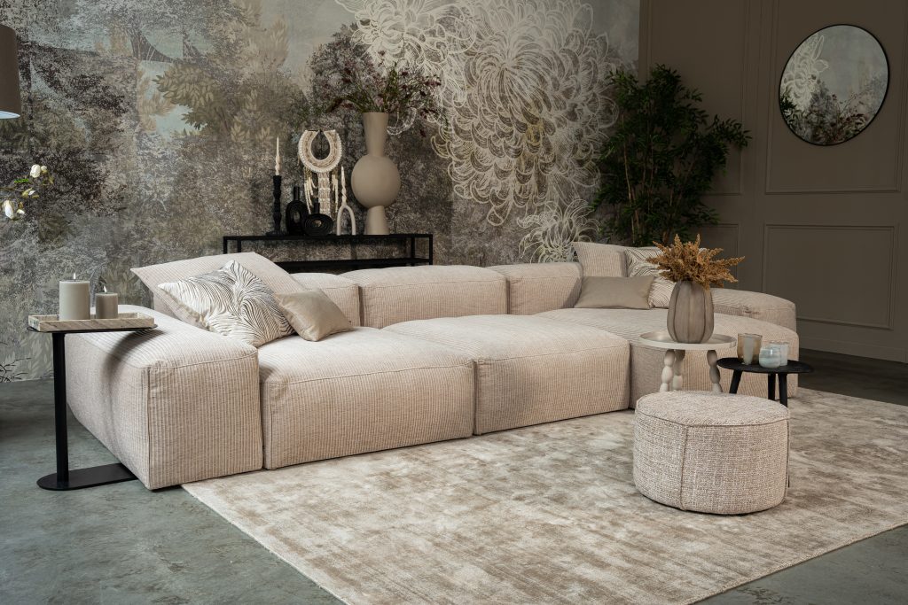 Light corner sofa with light and beige accessories.