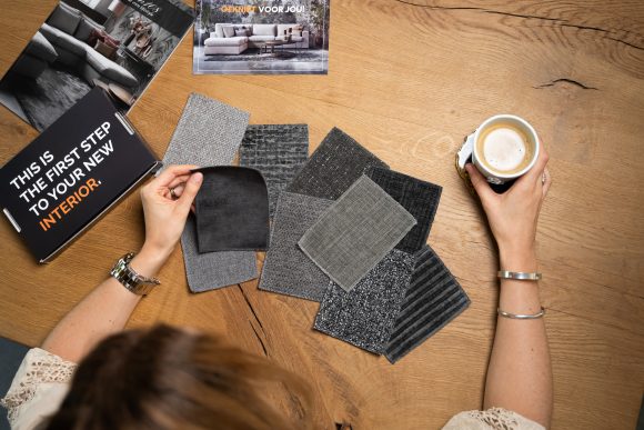 Dark and gray fabric samples on a table